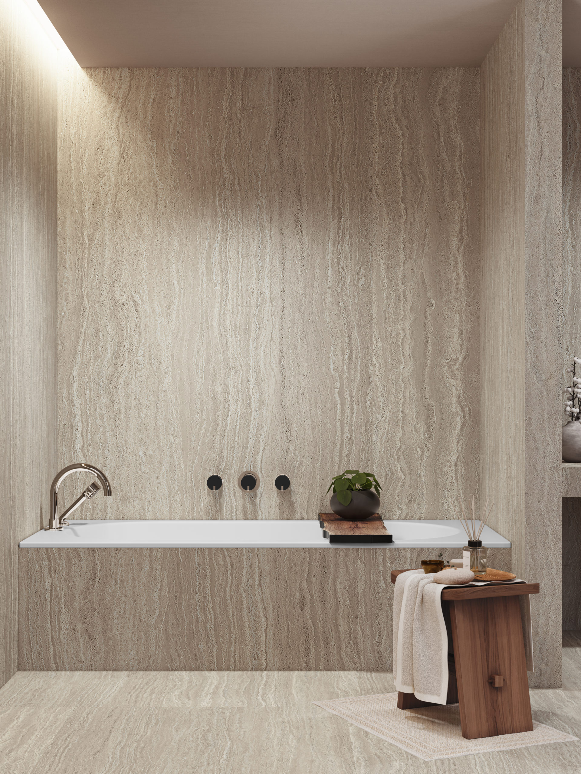 Salle de bain en travertin avec robinetterie en chrome. Travertin bathroom with chrome bathroom fittings.